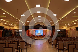 indian stage decoration with flowers and bells