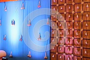 indian stage decoration with flowers and bells
