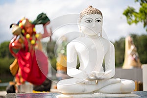 Indian statues on the background of the lake in Mauritius. Grand Bassin.