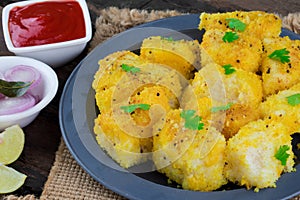 Indian Street Food Khaman Dhokla on Wooden Background