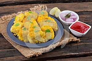 Indian Street Food Khaman Dhokla on Wooden Background