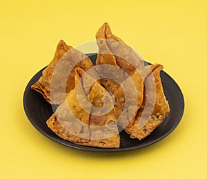 Indian Street Food Samosa or Samosas is a Crispy And Spicy Triangle Shape Snack