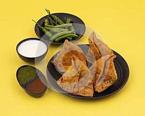 Indian Street Food Samosa or Samosas is a Crispy And Spicy Triangle Shape Snack