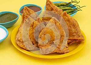 Indian Street Food Samosa or Samosas is a Crispy And Spicy Triangle Shape Snack