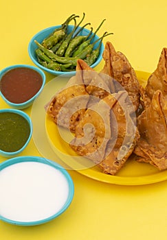Indian Street Food Samosa or Samosas is a Crispy And Spicy Triangle Shape Snack
