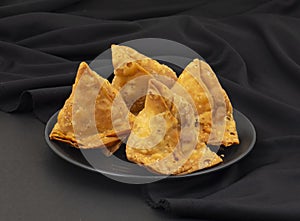 Indian Street Food Samosa or Samosas is a Crispy And Spicy Triangle Shape Snack