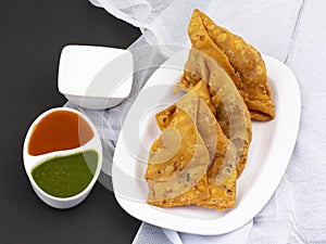 Indian Street Food Samosa or Samosas is a Crispy And Spicy Triangle Shape Snack