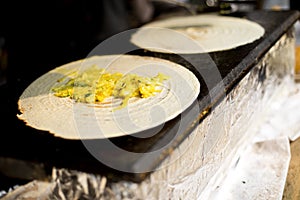 Cooking masala dosa at Surajkund Mela food stall photo