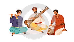 Indian street musicians playing traditional folk music on national instruments. Men in ethnic clothes performing on photo