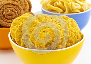 Indian Street Snack Food Masala Khari Papdi with Chakli or Besan Papdi on White Background