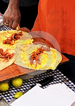 Indian street vendor making vegetarian spring rolls