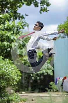 Indian Student achieving success   Jumping in air