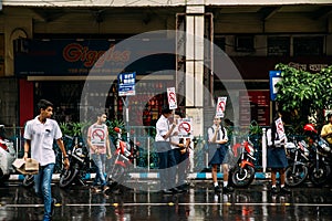 Indian student activists peacefully demanding for ` Silence, No Horn` on the road with yellow taxis in background in Kolkata.