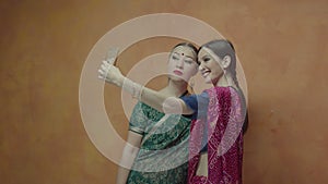 Indian style female friends posing for selfie shot