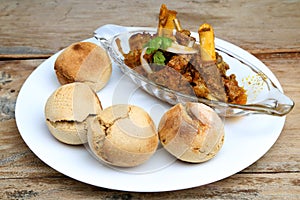 Indian style meat dish or mutton curry with bati