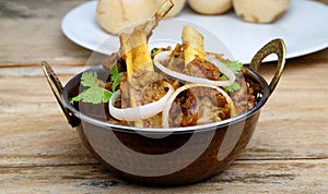 Indian style meat dish or mutton curry with bati