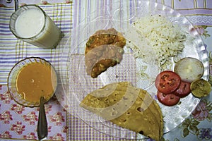 Indian Style thali contain indian food like roti sabji and dal rice photo