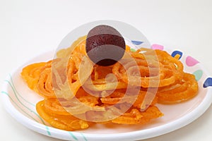 Indian sweet or dessert jalebi with kala gulab jamun