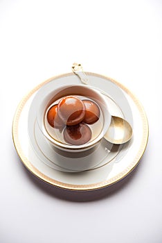 Indian sweet Gulab Jamun served in a ceramic bowl, selective focus