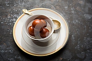 Indian sweet Gulab Jamun served in a ceramic bowl, selective focus