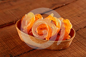 Indian Sweet Jalebi in a handmade pottery bowl on wooden background