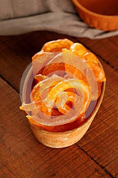 Indian Sweet Jalebi in a handmade pottery bowl on wooden background