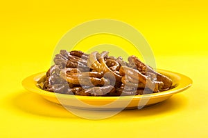 Indian sweet jalebi, indian dessert jalebi or imarti or imarati or jilbi on yellow background