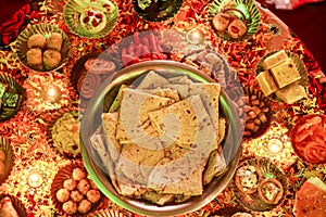 Indian sweets mithai & snacks in bowl for Diwali or any other festivals, selective focus