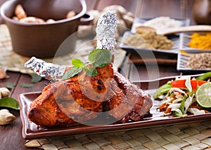 Indian tandoori chicken garnished