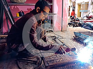 an indian technician doing welding work at service center in India January 2020