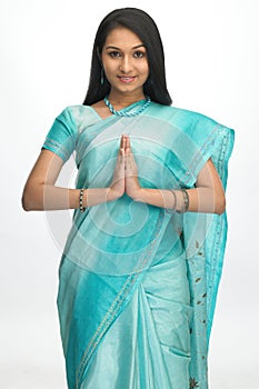 Indian teenage girl with folded hands