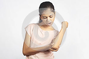 indian teenage girl having elbow pain