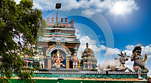 Indian temple in Pondicherry against the blue sunny sky