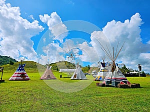 Indian Tent, Teepee Tent, Camping on the field over the blue sky.