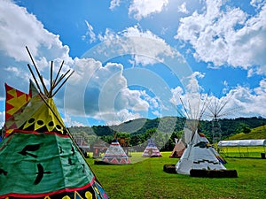 Indian Tent, Teepee Tent, Camping on the field over the blue sky.