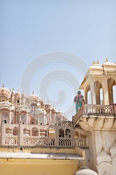 Indian tourist in sari on the tower of Hawa Mahal, Palace of the Winds, Jaipur, Rajasthan, Inidia