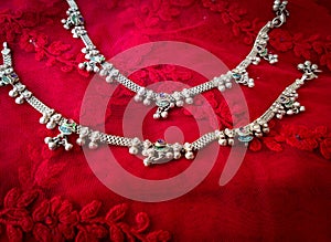 Silver anklet.