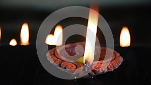 Indian traditional clay diya or oil lamp lits during the Diwali night