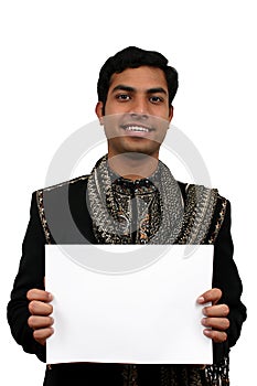 Indian in traditional clothes holding a white board in hand (2)