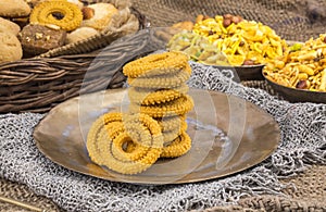 Indian Traditional Deep Fried Snack Chakli on Vintage Background