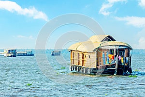 Indian traditional floating houseboats homes on Pamba river backwaters, Alappuzha, Kerala, South India