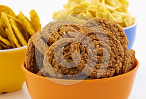 Indian Traditional Snack Chakli With Masala Khari Papdi or Besan Papdi on White Background