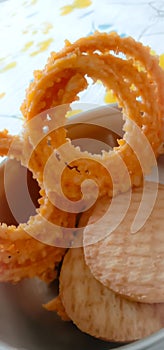 Indian traditional snacks Salty chakli and sweet biscuits