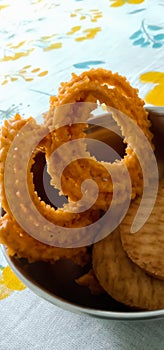 Indian traditional snacks Salty chakli and sweet biscuits