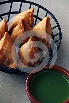 indian traditional street snack food samosa with chutney