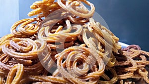 Indian Traditional Tea Time Snack Chakli, a deep fried snack, It is known as Chakali, Murukku, Muruku, Murkoo, Chakri