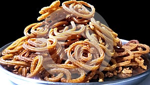 Indian Traditional Tea Time Snack Chakli, a deep fried snack, It is known as Chakali, Murukku, Muruku, Murkoo, Chakri