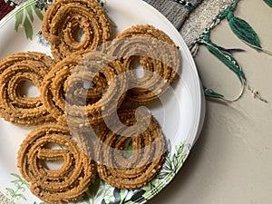 Indian Traditional Tea Time Snack Chakli, a deep fried snack, It is known as Chakali, Murukku, Muruku, Murkoo, Chakri.