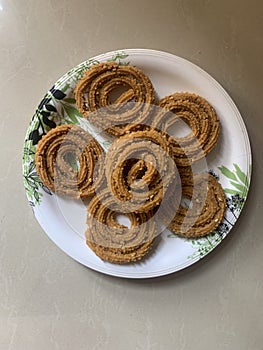 Indian Traditional Tea Time Snack Chakli, a deep fried snack, It is known as Chakali, Murukku, Muruku, Murkoo, Chakri.