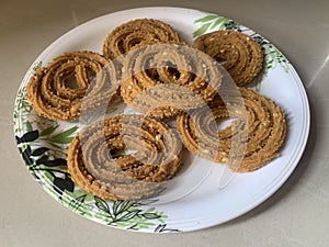 Indian Traditional Tea Time Snack Chakli, a deep fried snack, It is known as Chakali, Murukku, Muruku, Murkoo, Chakri.